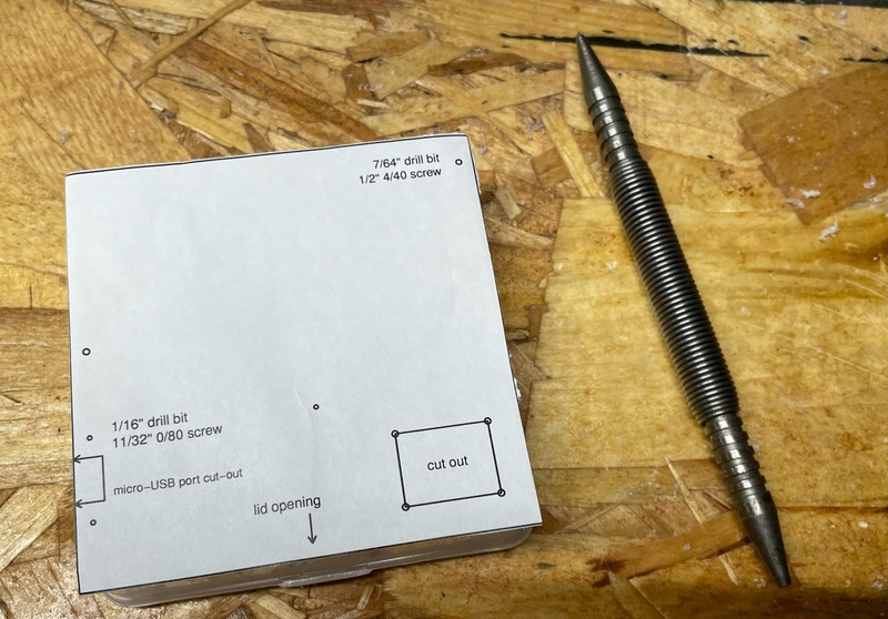 box with drilling template, with punch tool for marking drilling locations