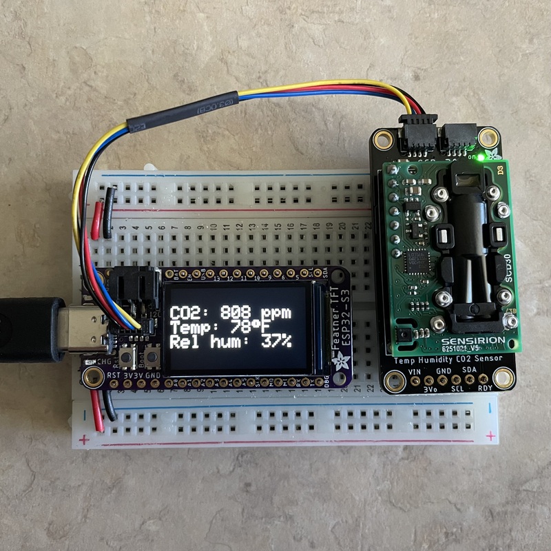 ESP32-S3 TFT connected to SCD-30 sensor, sitting on a breadboard but not soldered